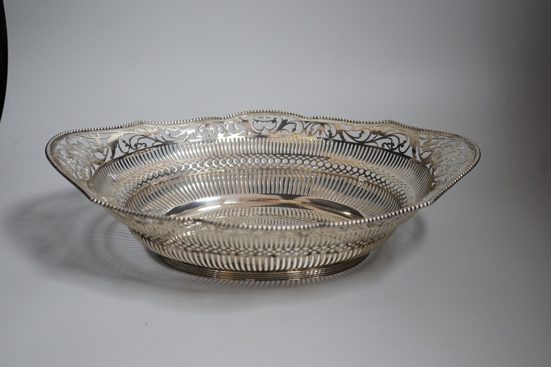 An early 20th century Dutch pierced white metal cake basket, 33.7cm, 16.5oz.